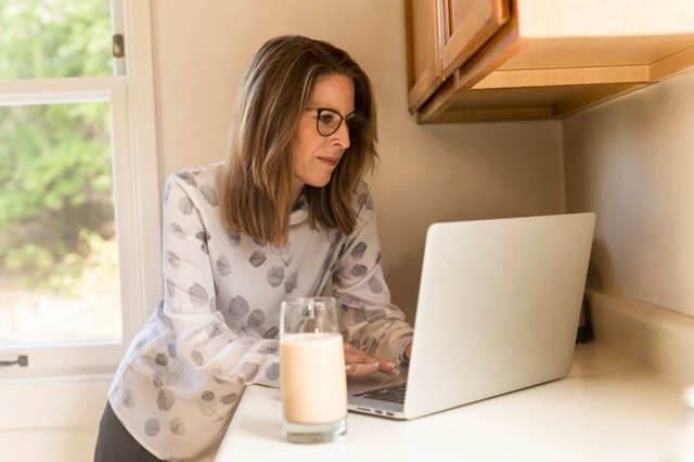woman working from home managing remote staff