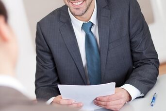 man smiling in an interview